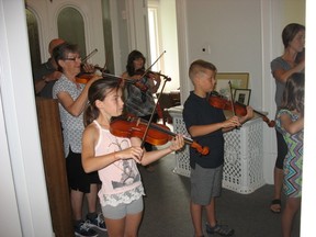 Violin enthusiasts learn the basics about playing the string instrument during the ISO's annual Summer Strings program.
CARL HNATYSHYN/SARNIA THIS WEEK