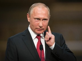 In this May 29, 2017, file photo, Russian President Vladimir Putin gestures as he speaks during a news conference with French President Emmanuel Macron at the Palace of Versailles, near Paris. Trump is eager to meet Russian President Vladimir Putin with full diplomatic bells and whistles when the two are in Germany for a multinational summit next month. (AP Photo/Alexander Zemlianichenko, File)