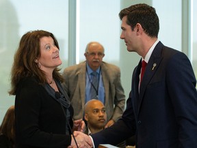 Minister of Seniors and Housing Lori Sigurdson shakes hands with Mayor Don Iveson following the announcement of a new provincial affordable housing strategy, during a press conference at the Federal Building, 9820 107 St., in Edmonton Monday June 26, 2017. Photo by David Bloom