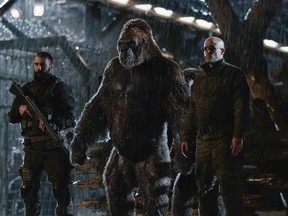 This image released by Twentieth Century Fox shows Woody Harrelson, center, in a scene from, "War for the Planet of the Apes." (Twentieth Century Fox via AP)