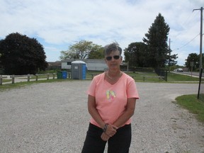 Janis Cookson’s house backs onto Little Creek Park in Port Stanley. A portable toilet was recently installed, and Cookson is not happy. She says the once beautiful, peaceful park is now marred by the unsightly amenity. (Laura Broadley/Times-Journal)