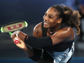 In this Jan. 28, 2017 file photo, United States' Serena Williams makes a backhand return to her sister Venus during the women's singles final at the Australian Open tennis championships in Melbourne, Australia. (AP Photo/Aaron Favila, File)
