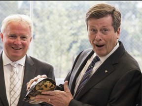 Mayor John Tory at the Toronto Zoo with a turtle. (CRIAG ROBERTSON, Toronto Sun)