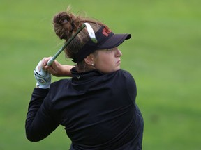 Abbie Anghelescu hits her approach shot on the first hole of the Cataraqui Women's Field Day and Empire Life Eastern Provinces Matches at the Cataraqui Golf and Country Club in Kingston on Monday. 
Elliot Ferguson/The Whig-Standard/Postmedia Network