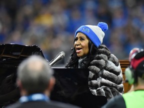 Aretha Franklin performs the national anthem before an NFL football game between the Detroit Lions and the Minnesota Vikings, Thursday, Nov. 24, 2016 in Detroit. (AP Photo/Jose Juarez)