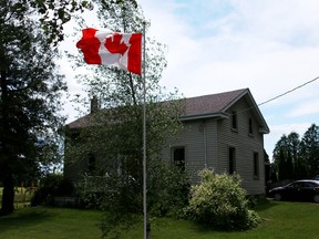 The 50-year-old Canadian flag that Simon Bruinsma is flying outside of his home on Middletown Line in Norwich Township for Canada's 150th anniversary. (BRUCE CHESSELL/Sentinel-Review)