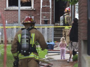 Kingston firefighters respond to a townhouse fire at 215 Weller Ave. on Tuesday morning. Witnesses said there was no one was home at the time of the fire. (Elliot Ferguson/The Whig-Standard)