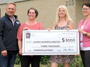 HuronTel and Hay Communications donated the $3,000 prize from their Canadian Cable Systems Alliance Tuned-In Awards to the Huron Women's Shelter. Accepting the donation was HuronTel's Glenn Grubb, Huron Women's Shelter's Donna Jean Forster-Gill, and Kelli Phillips and Angela Lawrence of Hay Communications.
