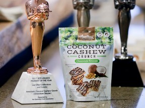 Anastasia Coconut Cashew Crunch is shown with its 2017 Sofi Awards Product of the Year specialty foods award, Thursday, June 22, 2017, in New York. The win came from among thousands of food and beverage items from more than 2,600 food artisans, importers and entrepreneurs from the around the globe at the annual Summer Fancy Food Show at the Javits Center. (AP Photo/Bebeto Matthews)