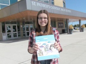 Sophia Makrigiannis, 14, holds a copy of a collection of the work by winners of Ontario English Catholic Teachers' Association Young Authors Awards, which includes the St. Patrick's Catholic High School Grade 9 student's winning short story, Guitar Strings and Coffee Beans, at the Sarnia school Tuesday June 27, 2017. (Paul Morden/Sarnia Observer/Postmedia Network)