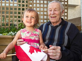 POSTMEDIA NETWORK - 
Renowned hockey coach Clare Drake poses for a photo with his great-granddaughter Lexington Cripps in 2013. Drake is being inducted into the Hockey Hall of Fame.