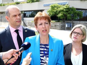 Nickel Belt MPP France Gelinas, middle, makes a point as Sudbury NDP candidate Jamie West and Ontario NDP leader Andrea Horwath look on during a press conference in Sudbury, Ont. on Tuesday June 27, 2017. John Lappa/Sudbury Star/Postmedia Network