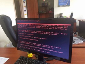 A computer screen cyberattack warning notice reportedly holding computer files to ransom, as part of a massive international cyberattack, at an office in Kiev, Ukraine, Tuesday June 27, 2017.(Oleg Reshetnyak via AP)