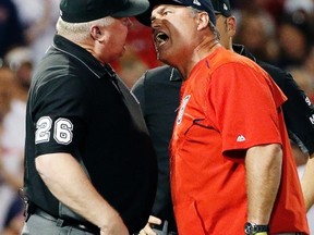 Boston Red Sox manager John Farrell, right, argues with third base umpire Bill Miller after a called balk during a game against the Los Angeles Angels on June 24, 2017, in Boston. (AP Photo/Michael Dwyer)