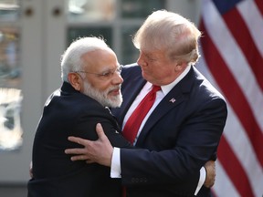 U.S. President Donald Trump and Indian Prime Minister Narendra Modi embrace while delivering joint statements in the Rose Garden of the White House in Washington, D.C., on Monday, June 26, 2017. (Mark Wilson/Getty Images)