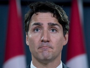 Prime Minister Justin Trudeau pauses as he speaks during a media availability at the National Press Theatre in Ottawa on Tuesday, June 27, 2017. (THE CANADIAN PRESS/PHOTO)