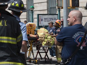 Emergency service personnel work at the scene of a subway train derailment, Tuesday, June 27, 2017, in the Harlem neighborhood of New York.(AP Photo/Mary Altaffer)