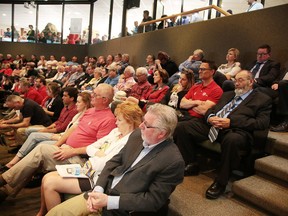 Ward 3 Coun. Gerry Montpellier (foreground right, wearing tie) watches from the gallery after declaring a conflict of interest at a special city council meeting in June to vote on the location of a new arena. A former member of the Sudbury Chamber of Commerce is now accusing Coun. Joscelyne Landry-Altmann of having a conflict of interest in the vote, which favoured the Kingsway site for an arena. (Gino Donato/Sudbury Star file photo)