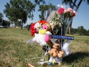 A memorial for Ashton Cardinal, 17, grows in a green space near Parkridge Estates at 29 Street and 116 A Avenue in Edmonton, Alta. on June 26, 2017. Cardinal was identified by family members as the 17-year-old boy found dead in the apartment complex's parking lot on June 23, 2017. Claire Theobald/Postmedia