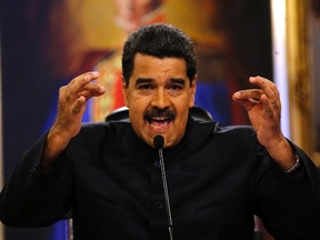 In this June 22, 2017 file photo, Venezuela's President Nicolas Maduro gives a news conference in Caracas, Venezuela. Maduro said a helicopter fired on Venezuela's Supreme Court in a confusing incident that he claimed was part of a conspiracy to destabilize his socialist government, on Tuesday, June 27, 2017. (AP Photo/Ariana Cubillos, File)