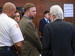Defendant Michael P. McCarthy looks at his attorney Jonathan Shapiro after a guilty of second degree murder against him at Suffolk Superior Court on Monday, June 26, 2017. McCarthy was convicted Monday of second-degree murder in the death of Bella Bond, a 2-year-old girl who became known as Baby Doe after her remains washed up on the shores of a Boston Harbor island. (Matt West/The Boston Herald via AP, Pool)