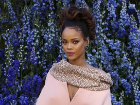 Barbadian singer Rihanna poses prior to the start of the Christian Dior 2016 Spring/Summer ready-to-wear collection fashion show, on October 2, 2015 in Paris. (PATRICK KOVARIK/AFP/Getty Images)