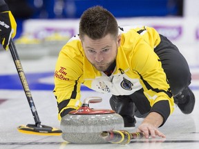 Manitoba skip Mike McEwen releases a rock as they play Alberta in draw 7 action at the Tim Hortons Brier curling championship at Mile One Centre in St. John's on Monday, March 6, 2017. THE CANADIAN PRESS/Andrew Vaughan