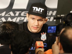 Former UFC heavyweight champion Junior Dos Santos, answers questions during a media availability Thursday, Oct. 17, 2013, in Houston. (AP)