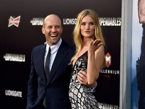 Jason Statham and model Rosie Huntington-Whiteley attend Lionsgate Films' "The Expendables 3" premiere at TCL Chinese Theatre on August 11, 2014 in Hollywood, California. (Photo by Frazer Harrison/Getty Images)