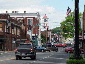 In this June 7, 2017 photo, vehicles drive through Hopkinsville, Ky. This town is considered the epicenter of the first total solar eclipse to sweep across the United States in 99 years on Aug. 21, 2017. (AP Photo/Alex Sanz)