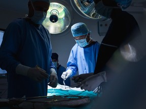 Surgeons work in an operating room in this stock photo. (Getty Images)