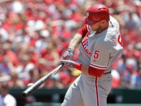 Philadelphia Phillies' Michael Saunders breaks his bat as he grounds out in the first inning of a baseball game against the St. Louis Cardinals on June 11, 2017. (AP Photo/Tom Gannam)