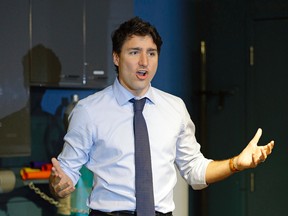 Prime Minister Justin Trudeau talks to families during a visit to the Telus World of Science in Edmonton on May 20, 2017. (Larry Wong/Postmedia Network)