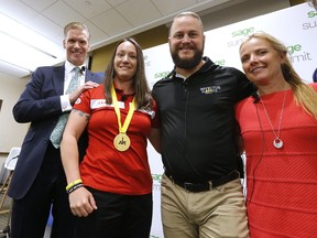 Sage CEO Stephen Kelly with Invictus Team Canada Captain Natasha Dupuis with her gold medal and Bruno Guevremont, former Team Captain and 2017 competitor along with Vicky Gosling, Sage Military Director at a press conference announcing their support of Team Canada in the upcoming Invictus Games in Toronto in September on Wednesday June 28, 2017. (Michael Peake/Toronto Sun)