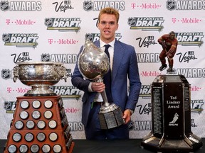 Connor McDavid of the Edmonton Oilers poses with the Art Ross Trophy, Hart Memorial Trophy and the Ted Lindsay Award after the 2017 NHL Awards and Expansion Draft at T-Mobile Arena on June 21, 2017 in Las Vegas, Nevada.