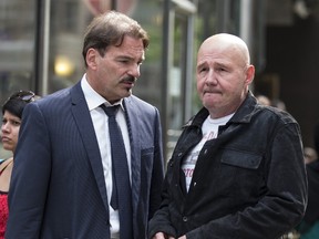 Mike Bullard (R) leaves College Park Court with his lawyer, William Halkiw, after Bullard was released on bail on Wed., June 28, 2017. (Craig Robertson/Toronto Sun)