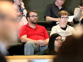 Jeff MacIntyre, board chair of Downtown Sudbury, and Maureen Luoma, executive director, look on during a special city council meeting at Tom Davies Square in this file photo. (John Lappa/Sudbury Star)