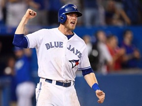 Toronto Blue Jays' Michael Saunders celebrates after scoring on a two-run single by Troy Tulowitzki against the Detroit Tigers during the eighth inning of a baseball game in Toronto, July 7, 2016. THE CANADIAN PRESS/Frank Gunn