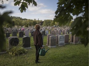Heather, not hear real name, at the Notre-Dame-des-Neiges Cemetery in Montreal on Wednesday, September 28, 2016. Heather recently had her car broken into and her purse stolen as she watered flowers at the gravesite of her brother and father at in the middle of the afternoon at the cemetery. (Dario Ayala / Montreal Gazette)