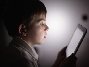 In this photograph illustration a ten-year-old boy uses an Apple Ipad tablet computer on November 29, 2011 in Knutsford, United Kingdom. (Photo by Christopher Furlong/Getty Images)