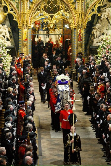 Members of the Royal Family follow the Queen Mother's coffin out of Westminster Abbey following her funeral service in London April 9, 2002. The funeral is the culmination of more than a week of mourning for the royal matriarch, who died March 30 at the age of 101. (ADRIAN DENNIS/AFP/Getty Images)