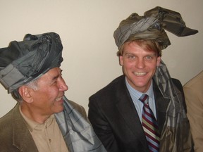 Wardak Province, Afghanistan - Christopher (Chris) Alexander wearing a ceremonial headdress that he and other dignitaries had been given at a road opening ceremony in Wardak Province. Postmedia Network file photo
