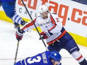 Toronto Maple Leafs' Dion Phaneuf and Washington Capitals' Karl Alzner during NHL playoff action at the Air Canada Centre in Toronto on Nov. 23, 2013. (Ernest Doroszuk/Toronto Sun)