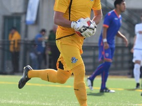 C Edmonton goalkeeper Nathan Igham holds the ball against Miami FC in North American Soccer League play at Clarke Stadium on June 10, 2017.