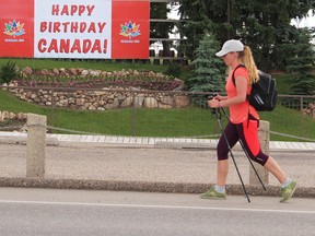 Palliser Regional Schools’ teacher Julie Macklin walks past the Brewery Gardens in Lethbridge as she finishes off A Journey of Healing. Her 100-kilometre trek from Vulcan to Lethbridge was to raise awareness of child abuse and funds for the Southern Alberta Children Advocacy Centre. The walk started last fall but was cut short at the half-way point after she suffered an injury. Photo courtesy of Palliser Regional Schools