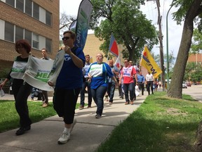 Manitoba Association of Health Care Professionals walk to protest health care system cuts on Thursday. (Jason Friesen/Winnipeg Sun)