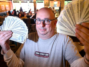 Elgin Street diner owner Ron Shrybman will celebrate Canada Day by  giving out the crisp dollar bills to 300 customers who eat at his diner, after 9 a.m. on Canada Day.