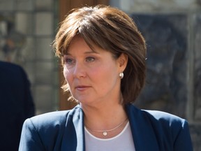 Premier Christy Clark walks from her office at the B.C. Legislature to the Legislature Chamber, to respond to the throne speech and attend a confidence vote in Victoria, B.C., on Thursday, June 29, 2017. The Liberal government was defeated on a confidence vote in the legislature. (Darryl Dyck/The Canadian Press)