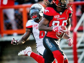 Calgary Stampeders Marken Michel with touchdown against the Ottawa Redblacks during CFL football in Calgary. (Al Charest/Postmedia)
