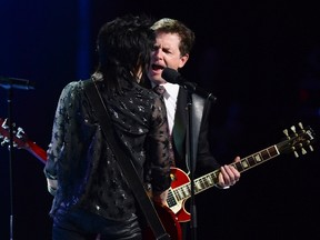 Michael J. Fox, right, performs onstage with Joan Jett during the Governor General's Performing Arts Awards gala at Rideau Hall in Ottawa on Thursday, June 29, 2017. Sean Kilpatrick, Canadian Press